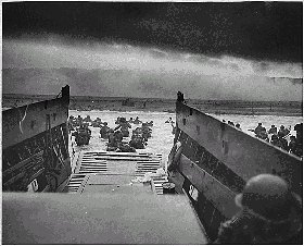 Black and white photo of U.S. troops landing at Omaha Beach in Normandy beaches, taken from inside the LCVT landing craft.